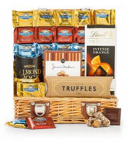 Indulge the chocolate lover with this best-selling assortment of world famous chocolates and gourmet confections. Paired with sweet companions, this gift creates a celebration that is truly decadent.