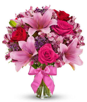 Red roses, pink lilies and pink alstroemeria and glass vase for delivery to Arizona