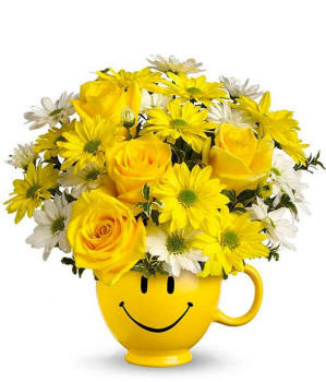 Yellow roses and bright daisies in a yellow smiley face mug for Illinois delivery