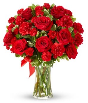 Red roses and carnations in a clear vase delivered to Illinois